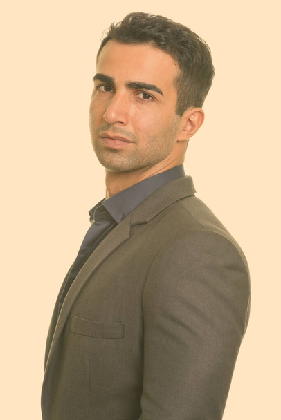 Portrait of young handsome Iranian businessman in suit - Foto, imagen