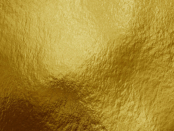 Fondo de lámina dorada con reflejos y textura desigual - Foto, Imagen