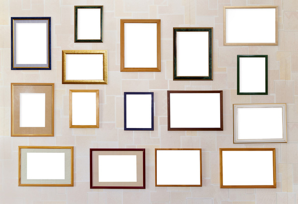 Many various photo frames hang on a wall. - Photo, Image