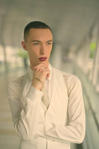 Young handsome androgynous businessman exploring the city of Bangkok, Thailand - 写真・画像