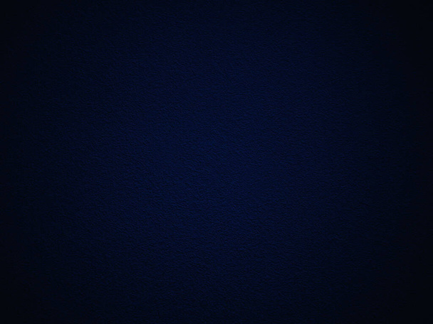Dark blue wall texture background with darkened edges - Foto, Bild