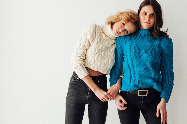 Two beautiful fashionable brunette women and blonde portrait girlfriends - Foto, Imagem