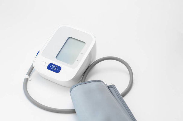 Digital tonometr on white background. Measurement of blood pressure. - Fotoğraf, Görsel