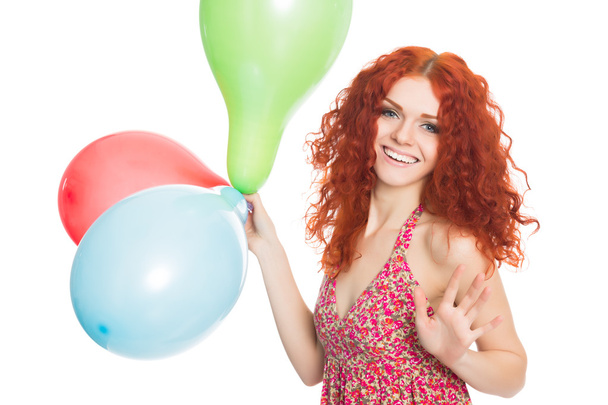Joyful girl holding colorful balloons - Foto, afbeelding