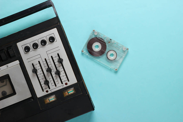 Old audio cassette player. Retro media on a blue background. Top view. - Photo, Image