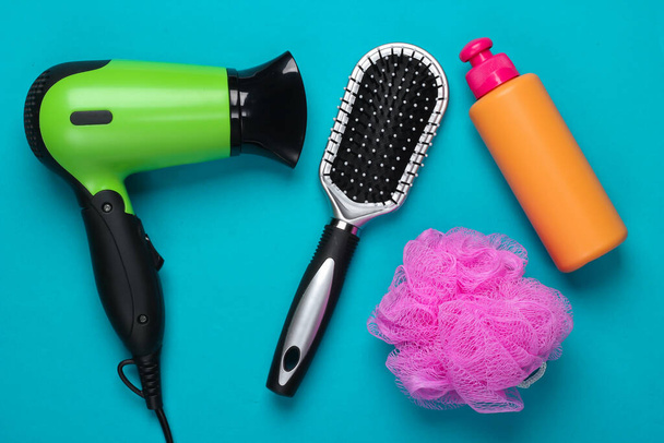 Set of products and devices for hair care on blue background. Top view. Flat lay - Photo, Image