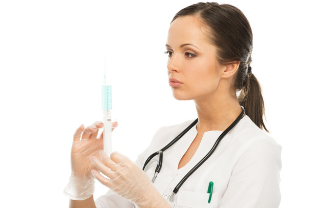Young brunette doctor woman with syringe isolated on white  - Fotografie, Obrázek