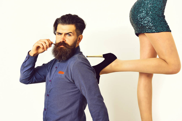 bearded man with sexy female legs has serious face - Foto, Imagem