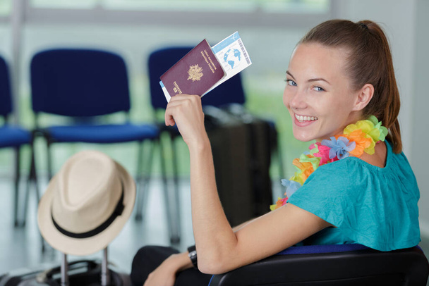 happy woman shows her passport - Фото, изображение