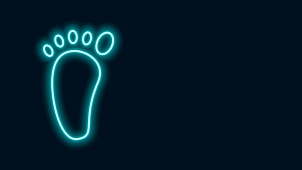 Gloeiende neon lijn Voet massage pictogram geïsoleerd op zwarte achtergrond. 4K Video motion grafische animatie - Video