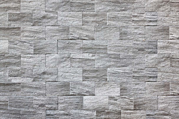 superficie della parete di pietra con cemento per lo sfondo
. - Foto, immagini