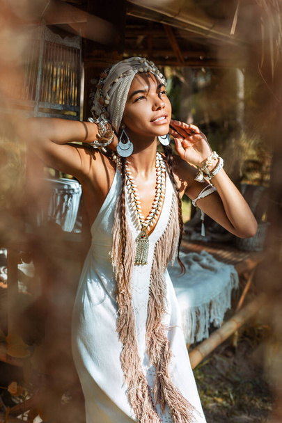 cheerful young beautiful woman in stylish white dress in bamboo pavilion - Φωτογραφία, εικόνα