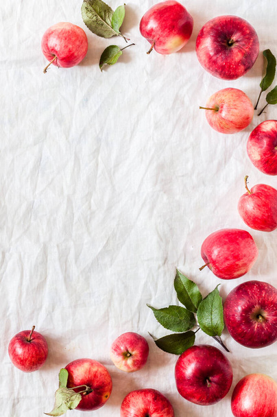 Ripe Red Apples with Leaves, Wrinkled White Cloth Background, copy space for your text - Fotoğraf, Görsel