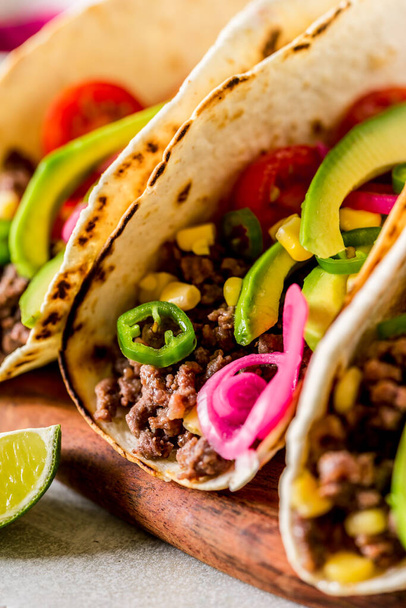 Mexican Minced Beef Tacos with Vegetables and Corn Salsa, close up - Foto, imagen