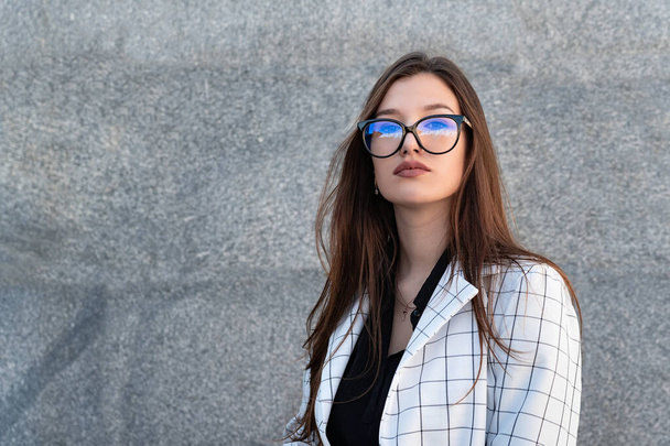 Portrait of young beautiful brunette woman in glasses. - Photo, Image