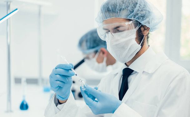 background image of a laboratory assistant in a medical laboratory - Foto, afbeelding