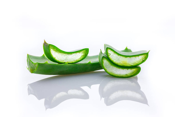 Aloe vera in pieces in front of white background - Photo, Image