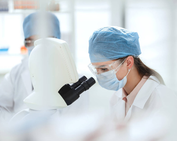 female scientist conducts research in a medical laboratory. - Zdjęcie, obraz