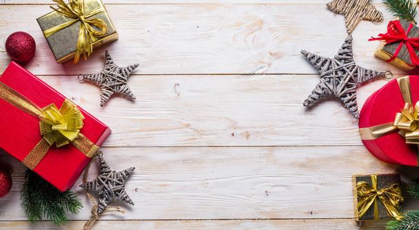 Christmas decor and gift boxes on the wooden table. Christmas or New Year holiday background. Top view. - Foto, immagini