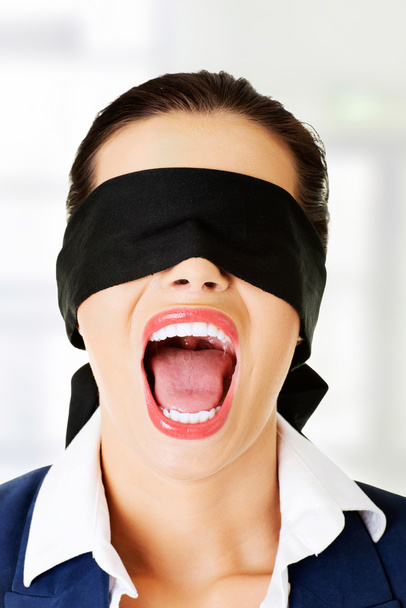 Beautiful frighten young blindfold woman - Foto, afbeelding