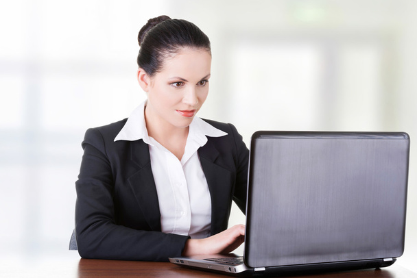 Businesswoman working on laptop - Photo, Image