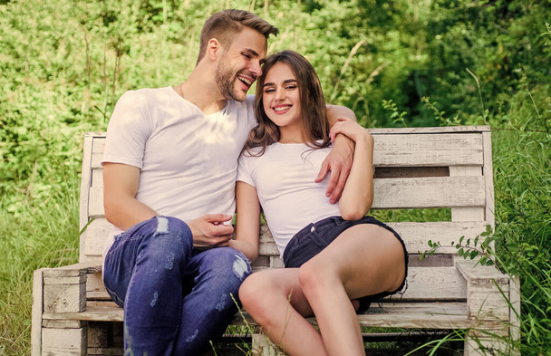 family weekend. romantic date. man with girl in park. couple relax outdoor on bench. Togetherness. happy valentines day. summer camping in forest. couple in love. Casual fashion. Loving all about her - Zdjęcie, obraz