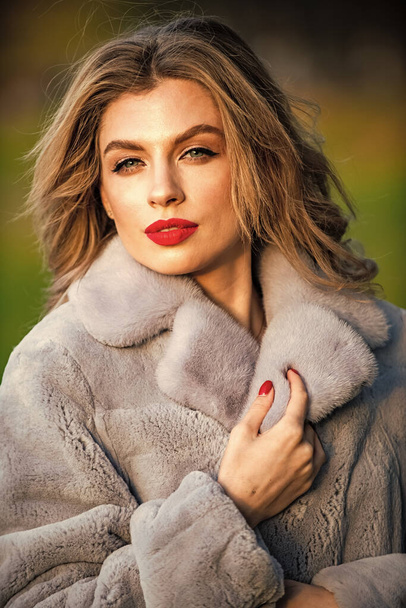 Fur boutique. Soft jacket furry texture. Sexy woman red lips wear fur coat. Businesswoman in fur coat. Simple and warm. Glamorous lady. Cosy autumn outfit. Winter fashion trends. Luxury segment brand - Foto, imagen