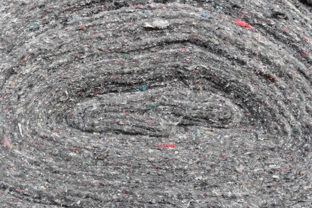 Rolls of factory textiles close-up. Raw material or material for making rags. Background with space to copy - Photo, Image