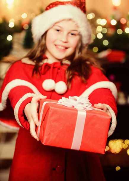 Winter season sale. Shopping and discount. Christmas is time for giving. Festive atmosphere christmas day. Girl santa claus costume hold christmas gift box. Buy gift now. Open gift. Happy moments - Foto, Imagen