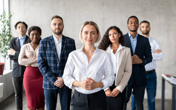 Successful Businesswoman Standing In Front Of Business Team In Office - Photo, Image