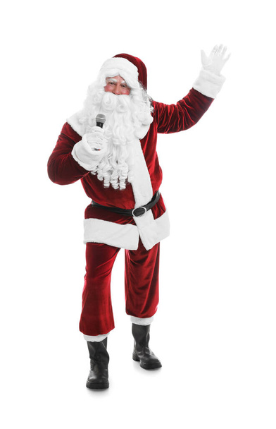Santa Claus singing with microphone on white background. Christmas music - Φωτογραφία, εικόνα