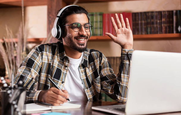 Arab Student Guy At Laptop Waving Hello Learning At Home - Photo, Image