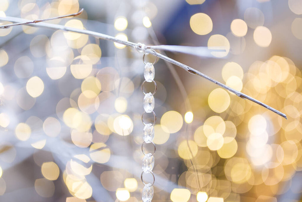 Unfocused shot of Christmas background. Shiny sparkling garland lights and bokeh. Copy space.  - Foto, Bild