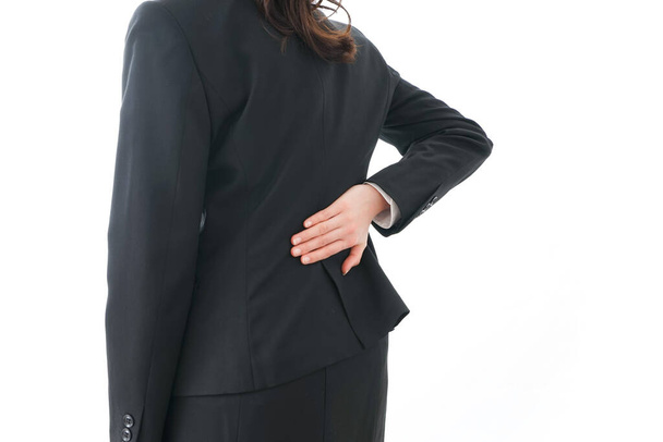 mujer de negocios que sufre de dolor de espalda - Foto, Imagen