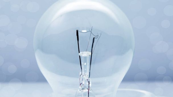 Light bulb on blue background - Photo, Image