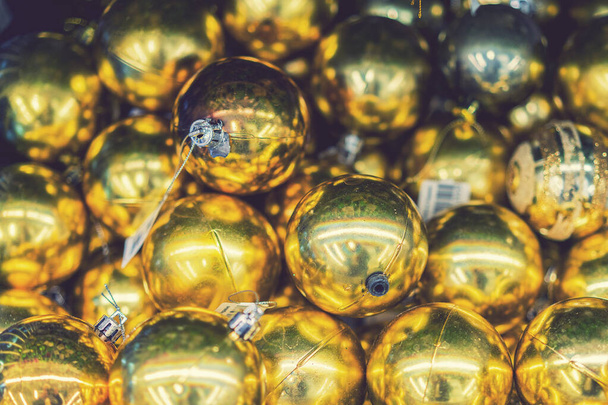 beautiful golden christmas balls on a golden background. Christmas balls close up picture. background. - Fotoğraf, Görsel