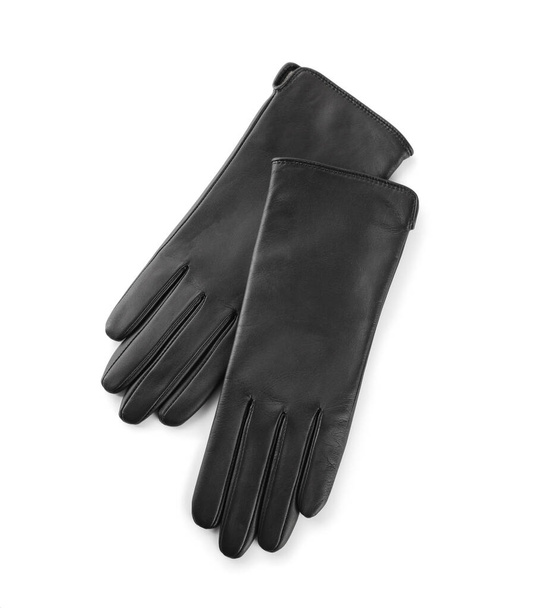 Stylish black leather gloves on white background, top view - 写真・画像