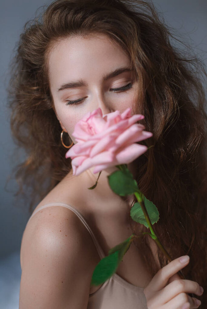 portrait of a beautiful girl with a rose - Fotoğraf, Görsel