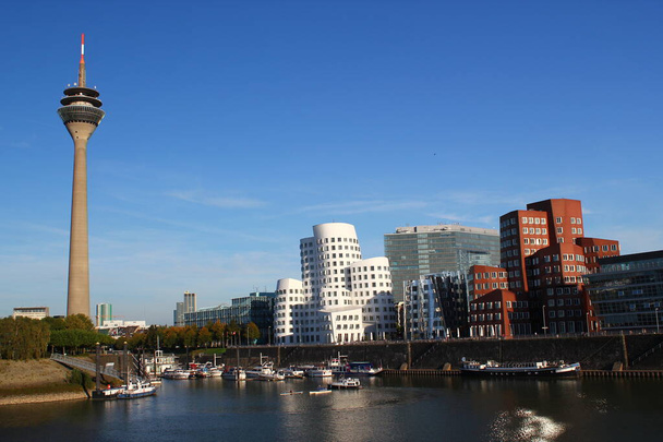 Iconic architectural buildings next to the Duesseldorf tower with a lake view - Photo, Image