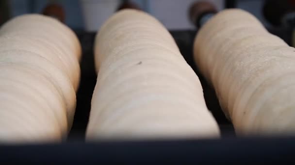 Trdelnik being cooked in Prague's christmas market. Close up.Mid angle, traveling movement, slow motion, HD. - Footage, Video