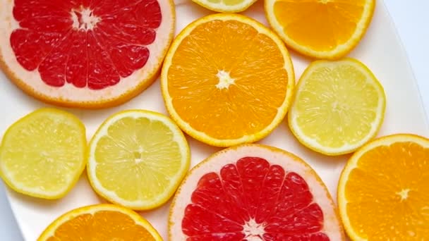 Sliced grapefruit, orange and lemon - Video, Çekim