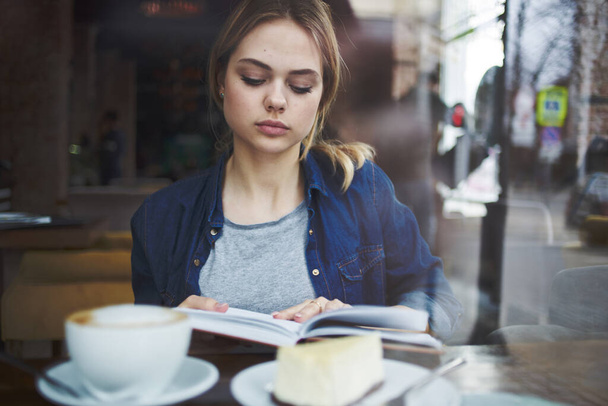 Woman reading book cafe vacation lifestyle Cup of coffee in the morning - Photo, Image