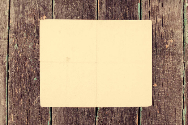 Old paper on wooden background, empty templates, mock-up. - Photo, Image