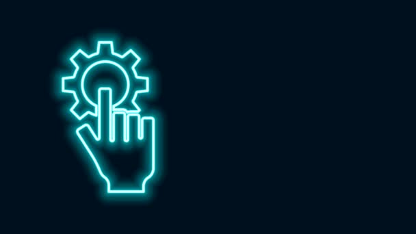 Glowing neon line Settings in the hand icon isolated on black background. 4K Video motion graphic animation - Footage, Video