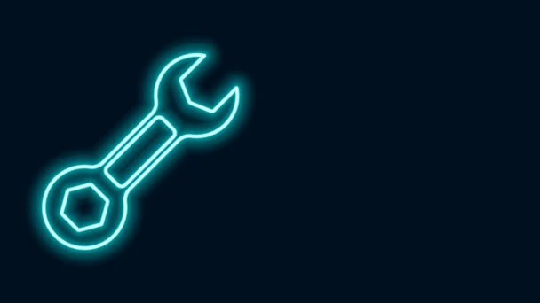 Világító neon vonal Wrench csavarkulcs ikon elszigetelt fekete háttérrel. 4K Videó mozgás grafikus animáció - Felvétel, videó