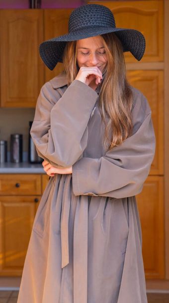 A gorgeous brunette model poses in lingerie in a home environment - Valokuva, kuva
