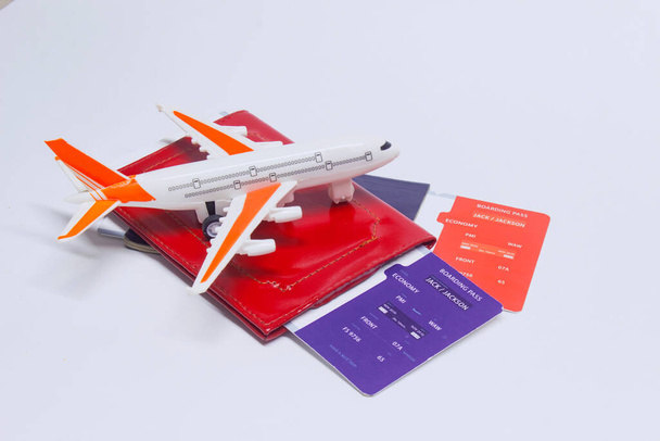 Time to travel. Tourism concept with airplane, boarding tickets and passport - 写真・画像
