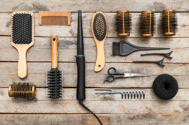 Set of hairdresser tools on wooden background - Foto, Imagem