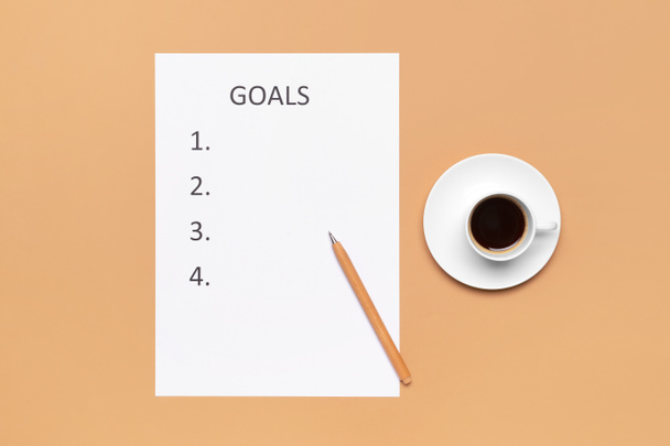 Empty to do list with cup of coffee on color background - Photo, Image
