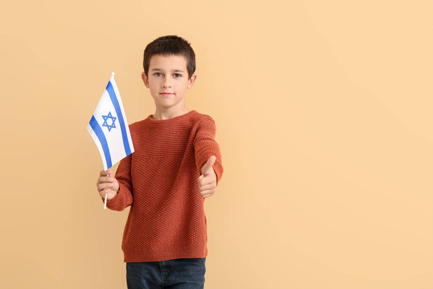 Little boy with the flag of Israel showing thumb-up on color background - Фото, изображение
